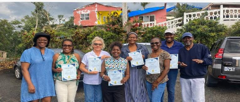 The Bogue Heights heroes gleefully displaying their certificates of appreciation.