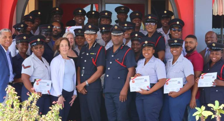 Commissioner, Jamaica Fire Brigade (JFB), Stewart Beckford (fourth left, front row), and Assistant Commissioner, Andrew Russell (fifth left), share a photo with the first cohort of Emergency Telecommunicators, along with facilitators of the Emergency Telec