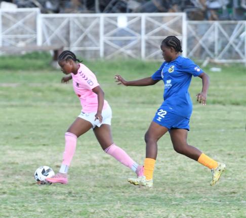 Frazsiers Whip’s Kersha Thomas dribbles away from Springers United FC’s Jasheika Harris during a Jamaica Women’s Premier League fixture at the Excelsior High School on Saturday.