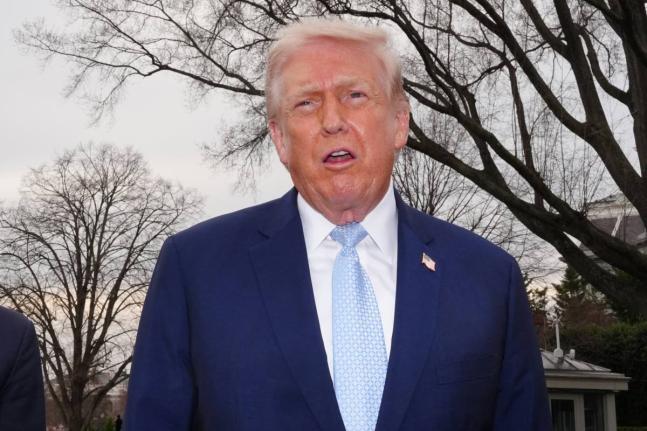 President Donald Trump speaks with reporters before departing on Marine One from the South Lawn of the White House, Friday, March 20, 2026, in Washington. (AP Photo/Alex Brandon)