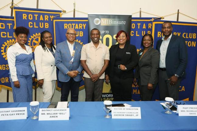 Mayor of Kingston Andrew Swaby (centre) and District Governor for Rotary District 7020, Professor William ‘Bill’ Aiken (third from left) and wife, Dr Ella Britton-Aiken (second from left), share the spotlight with sponsors and conference planning commi