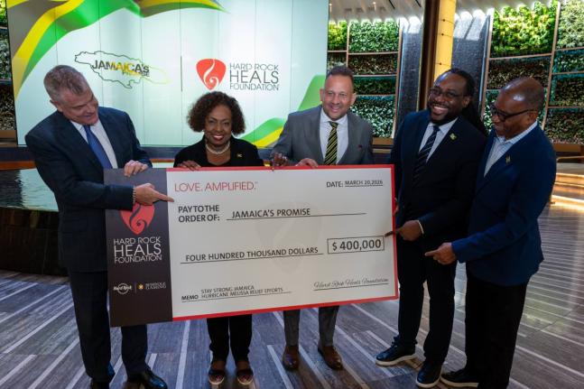 Minister of Culture, Gender, Entertainment and Sport Olivia Grange (second left) is joined by David Hoenemeyer, chief operating officer of Seminole Gaming (left), and Jamaica’s Consul General to Miami Oliver Mair (third right), for a ceremonial cheque ha