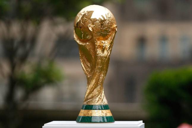 The FIFA World Cup Trophy is displayed before press conference at Rockefeller Plaza, June 16, 2022, in New York. (AP Photo/Noah K. Murray, File)