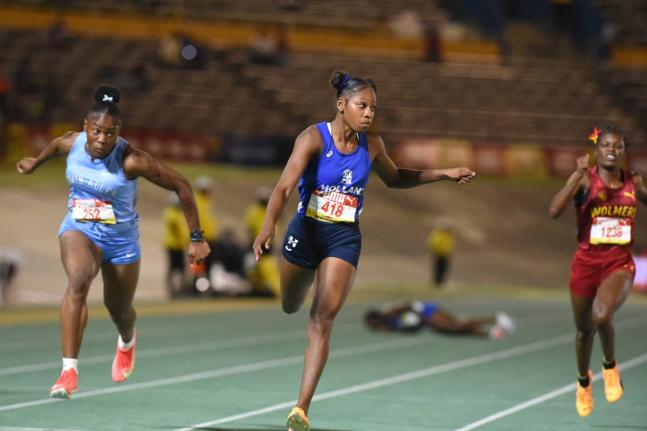 Holland High School’s Shanoya Douglas (centre) powers to victory in the girls’ Class One 100m final at the 2026 ISSA/GraceKennedy Boys and Girls’ Athletics Championships on March 25, clocking a personal best 10.98 seconds.