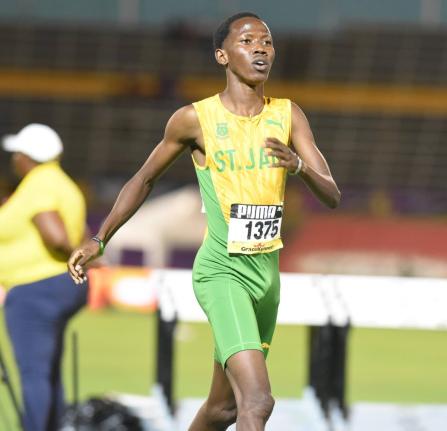 St Jago High’s Ryan Achau wins the Class One 1500 metres at the National Stadium on Wednesday night. Achau crossed the finish line in 3:50.71. 