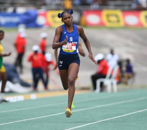 Shanoya Douglas on her way to winning the girls’ Class 1 200m in a championship record at the 2026 ISSA/GraceKennedy Boys and Girls’ Athletics Championships inside the National Stadium yesterday. 