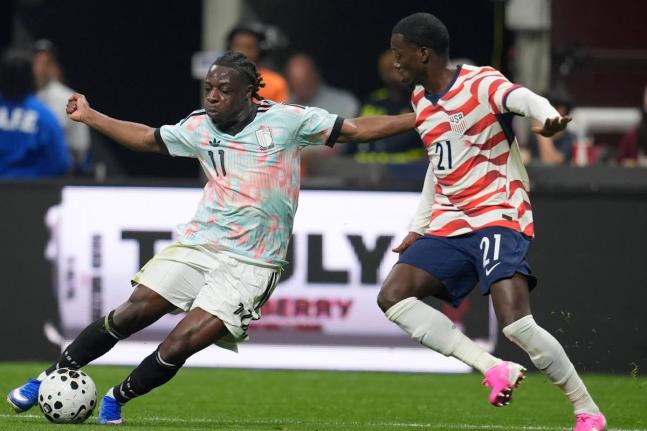 
Belgium’s Jeremy Doku (left) tries to get by the United States’ Timothy Weah during an international friendly football match in Atlanta yesterday.