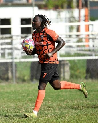 Tivoli’s Rodico Wellington runs to the centre circle after scoring the equaliser against Harbour View at the Edward Seaga Sports Complex yesterday. 