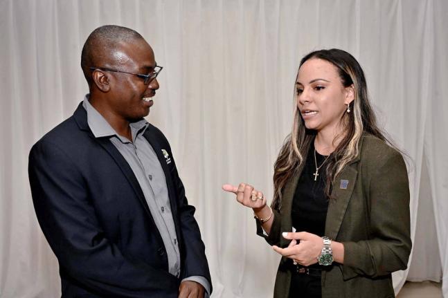 Gabrielle Gilpin-Hudson, president of the Realtors Association of Jamaica, in conversation with Gregory Bennett, deputy CEO, Spatial Planning Division, National Environment and Planning Agency, during the RAJ Green Sustainability event held recently at the