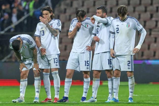Italy’s players react during a penalty shoot-out during the World Cup qualifying playoff final football match against Bosnia and Italy in Zenica, Bosnia, yesterday.