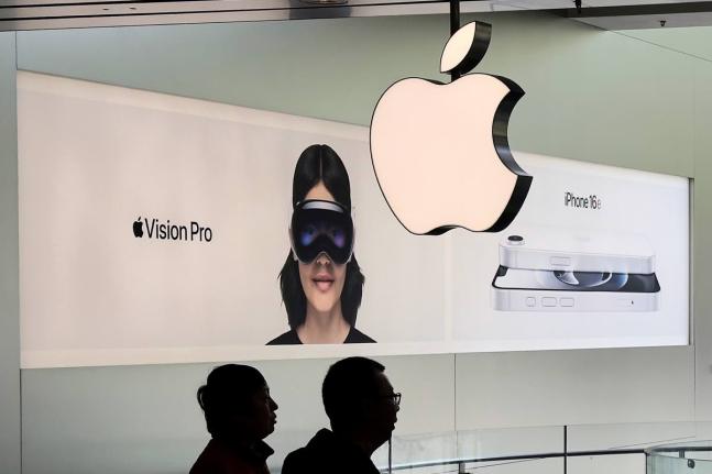AP
People visit an Apple Store, inside a shopping mall, in Beijing, China, Thursday, April 10, 2025. 