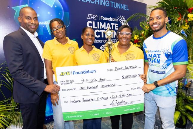 Hugh Grant (left), president & CEO of JPS, and Aundhrae Richardson (right), JPS Foundation officer, pose with representatives of St Hilda’s Diocesan High School, which was named the JPS Foundation Power Up Energy Club of the Year during the JPS Foundatio