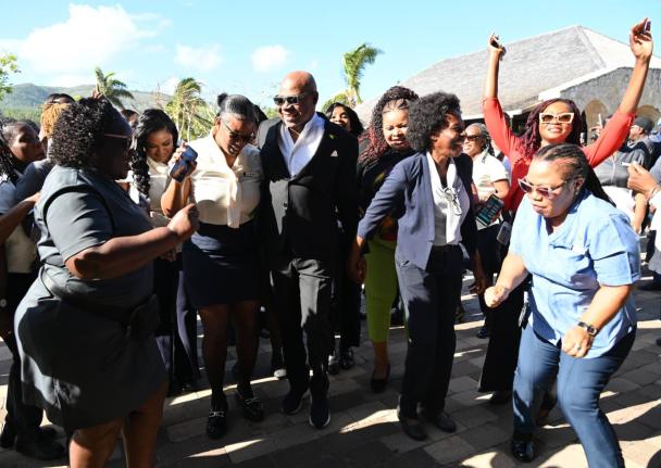 Tourism Minister Edmund Bartlett with tourism workers at the April 2 opening of Half Moon, where he announced that the Tourism Workers Pension Scheme has grown to $6 billion and outlined intentions to introduce a health plan next.