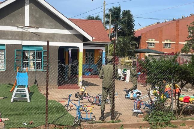 Uganda police officers stand at the crime scene after a man killed four children in a machete attack at the Gaba Early Childhood Development Program nursery school in Kampala, Uganda, Thursday, April 2, 2026. (AP Photo)