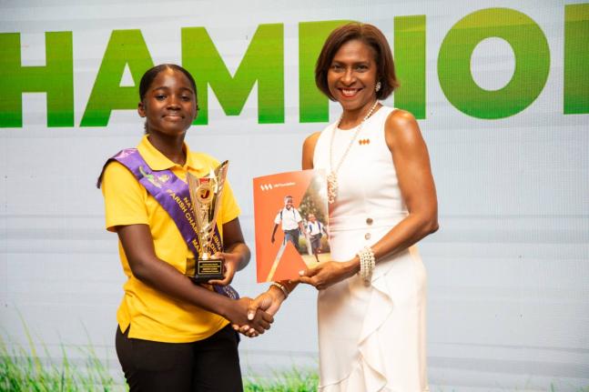 Kristen Lewis (left), the 2025 National Champion for the 12-14 age group, alongside Samantha Charles, CEO, VM Foundation, title sponsor of the National Reading Competition. Lewis is encouraging this year’s young entrants to be determined, ambitious and c
