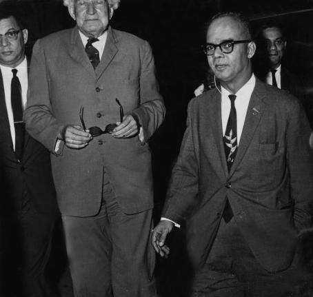 Sir Alexander Bustamante (centre), prime minister of Jamaica, is seen at Piarco Airport terminal building with Eric Williams (right), prime minister of Trinidad and Tobago. In the background are Donald Sangster (left) and Arthur Brown .  