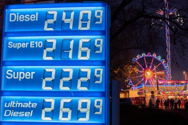 Gas prices are displayed near a ferris wheel in Frankfurt, Germany, Thursday, April 2, 2026. (AP Photo/Michael Probst)