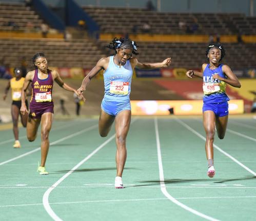 Ian Allen/Photographer 
Edwin Allen High School’s Kellyann Carr (centre) wins the Girls’ Class One 400 metres ahead of Hydel’s Nastassia Fletcher (right) and Holmwood Technical’s Abrina Wright at the ISSA/GraceKennedy Boys and Girls’ Athletics Ch