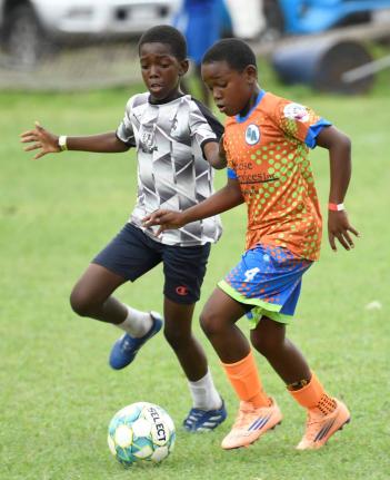Antoine Lodge/Photographer 
Next Cup action between the black and whites of Kingston Central and Charlton’s Academy at the UWI Mona Bowl yesterday.