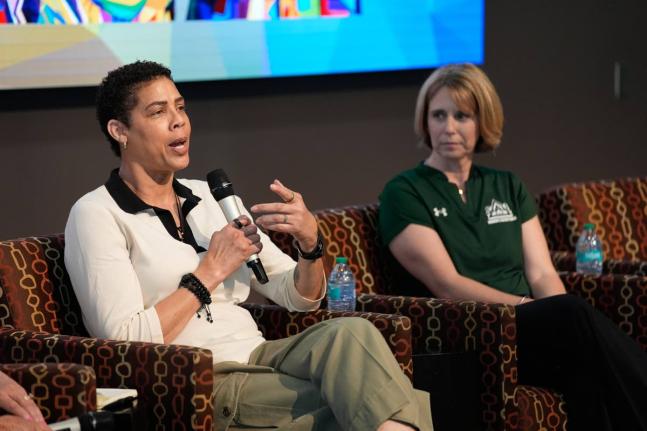 Former basketball player Cheryl Miller  (left) speaks beside Julie Church, Delta State women’s basketball assistant coach, during an event on Thursday, April 2, 2026, in Phoenix.  