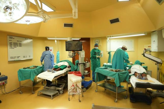 Ophthalmologists operate on two patients during a marathon cataract event, in Tsakane, South Africa.