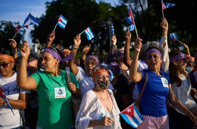 Women attend a rally calling for the end of the US blockade against the island nation in Havana, Cuba, Tuesday, April 7, 2026. 