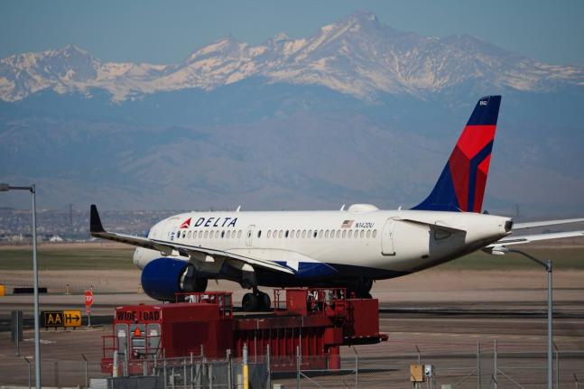 A Delta Airlines jetliner taxis to a runway for take off from Denver International Airport, March 20, 2026, in Denver. (AP Photo/David Zalubowski, File)