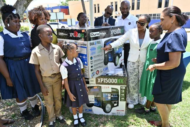 Latoya Harris Ghartey (second left), executive director, National Education Trust (NET); Kennecy Davidson (fifth left), assistant chief education officer; Everette Riley (sixth left), senior education officer for Region 4; Roger Hinds (seventh left), of Ja