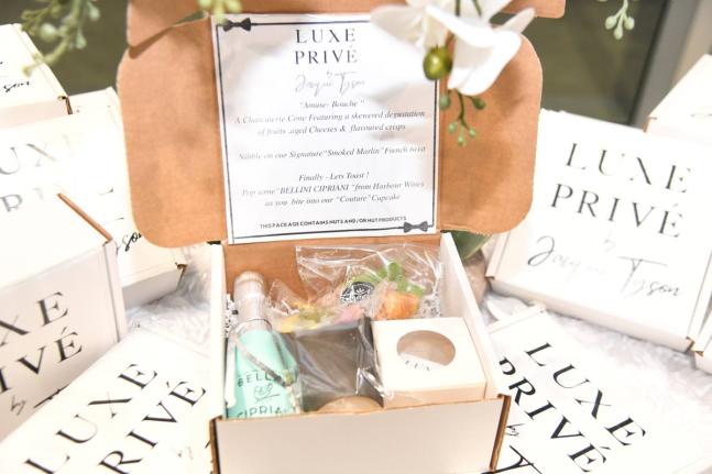Chef Jacqui Tyson’s Luxe Privé Gourmet Box offers an elevated take on the classic picnic experience, featuring Bellini Cipriani prosecco, charcuterie in a cup, smoked marlin with a French-inspired twist, and a croissant and cupcake pairing designed as a