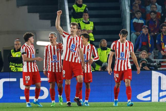 Atlético Madrid’s Alexander Sorloth (centre) celebrates after scoring his side’s second goal during the Champions League quarter-final first-leg match against Barcelona in Barcelona, Spain, yesterday.