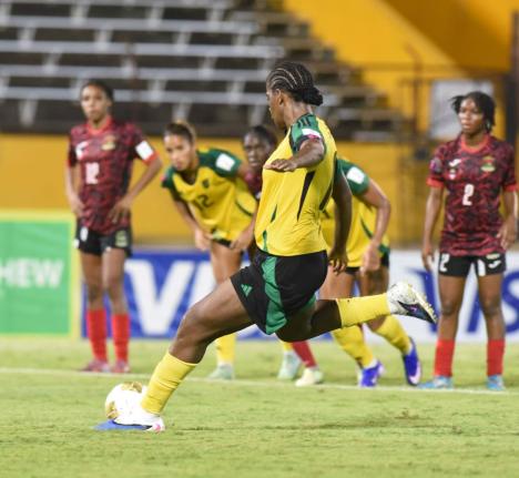 Reggae Girlz Captain, Khadija Shaw, prepares to strike the penalty that opened the scoring for Jamaica on her way to a hat-trick in a 4-0 win over Antigua and Barbuda inside the National Stadium tonight.