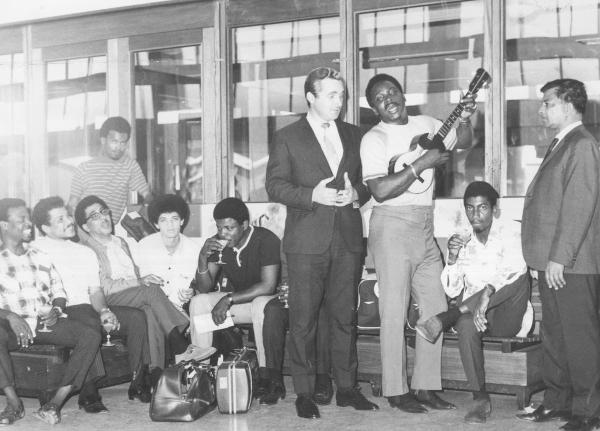 In this 1969 photo, The Mighty Sparrow and his 15-piece calypso band, the Troubadours, are seen at the Palisadoes Airport being received by Patrick Alexander (in suit at centre), entertainment manager of the Courtleigh Manor Hotel. At right is Cyril Shaw (