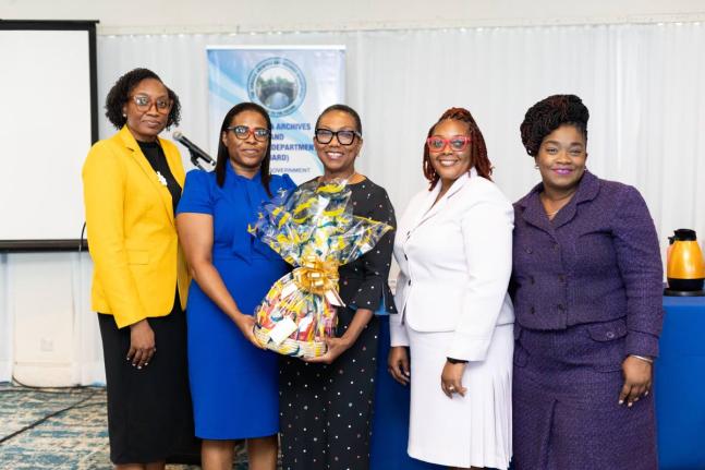 British High Commissioner to Jamaica Alicia Herbert (centre) with (from left) Ketanya Laing, acting government archivist, Jamaica Archives and Records Department (JARD); Princess Gordon‑Commock, senior archivist, audio‑visual unit, JARD; Racquel Stratc