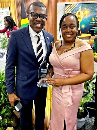 Anisa Wilson‑Smith, executive director of Life Skills Education Ltd and Excellence in Education awardee, with St Ann Chamber of Commerce president, Dr Ransford Davidson, at a recent award ceremony.
