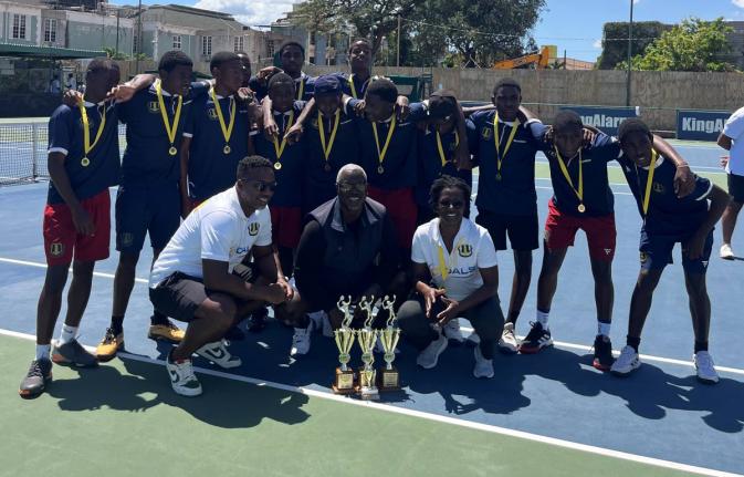 Members of the Munro College tennis team with (in front, from left)  manager Kirk Radway, coach Andre Brown and assistant coach Suan Reid. 