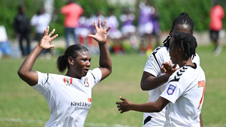 From left: Arnett Gardens’ Anna-Kay Richards celebrates with teammate and goalscorer Shikira Douglas, and Tasheka Reid (partially hidden) during a Jamaica Women’s Premier League encounter against Real Mona at the Alpha institute yesterday.