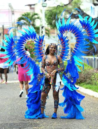 Tiffany Hill of the Xodus OlympiX band takes part in Carnival road march in St Andrew on April 12, 2026. 

