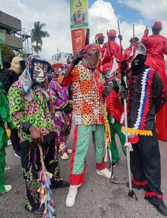 Members of the Kayah Junkunno band mix and mingle with Yard Mas revellers during Sunday’s road march.