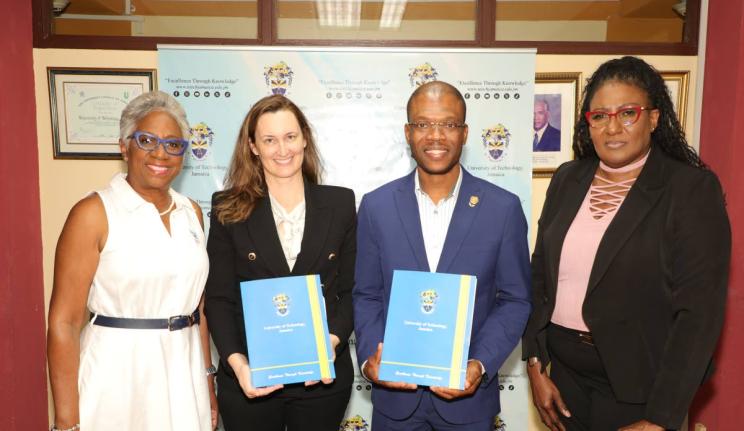 From left: Sandra Glasgow, managing director of RevUp Caribbean Limited; Melanie Subratie, chairman of FirstAngels Caribbean Limited; Dr Kevin Brown, president of the University of Technology, Jamaica (both holding folders containing signed copies of the a