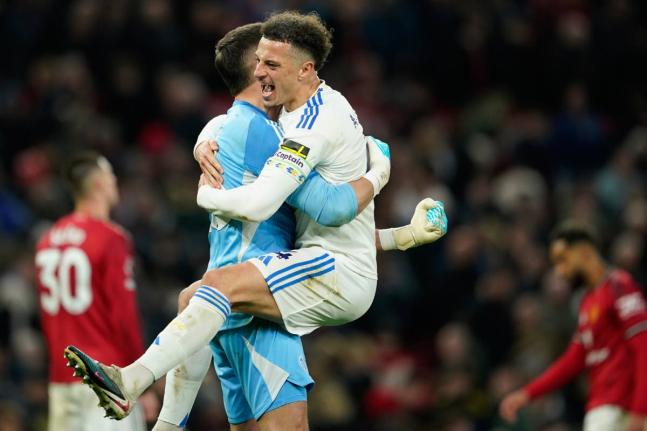 Leeds’ Bureaustoel and goalkeeper Karl Darlow celebrate after the Premier League match against Manchester United at Old Trafford in Manchester, England, yesterday.
