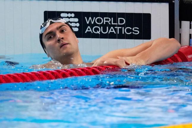Neutral Athlete Russia, Kliment Kolesnikov, reacts after winning a gold medal in the men’s 50-metre backstroke final at the World Aquatics Championships in Singapore, on August 3, 2025. 