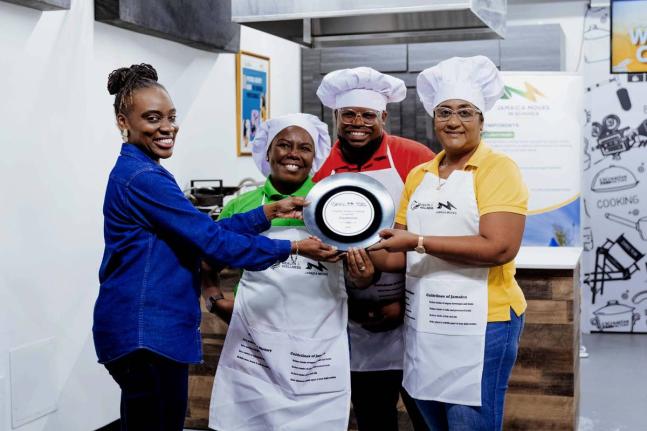 Takese Foga (left), director, health promotion & education, Ministry of Health & Wellness, presents the top award to Salina Campbell, Rasheed Whyte and Chaudine Parker of the Sugar Industry Authority, winners of the Healthy Recipe Cook-Off Challenge. The c