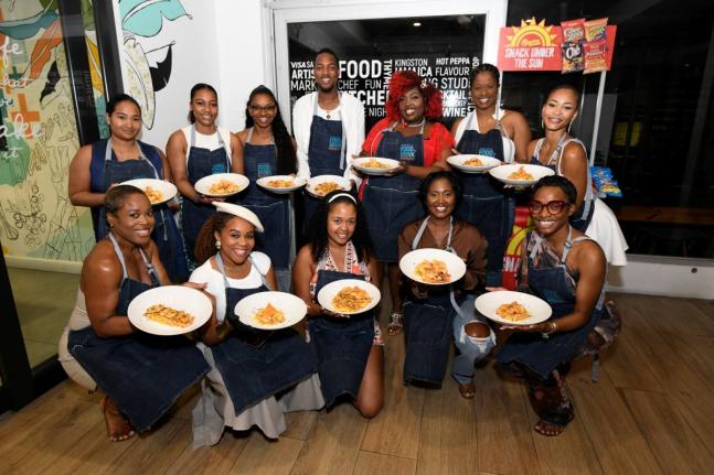 Participants in the Tabanca in the Kitchen: Passport to New Orleans session pose with their completed dishes on Monday. 