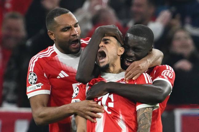 Bayern Munich’s Luis Diaz (centre) celebrates with Dayot Upamecano (right) and Jonathan Tah after scoring his side’s third goal during the Champions League quarterfinal second leg football match against Real Madrid in Munich, Germany, yesterday.