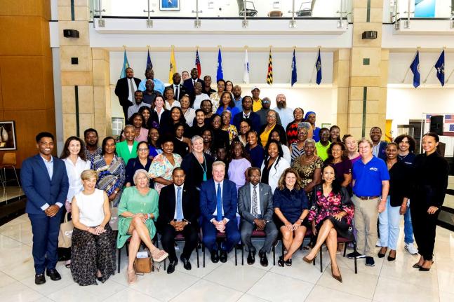 Agriculture Minister Floyd Green (seated, third right); US Chargé d’Affaires Scott Renner (centre); and US Ambassador N. Nick Perry (seated, third left) pose with representatives of American Friends of Jamaica and grant recipients at the 2026 AFJ Annual