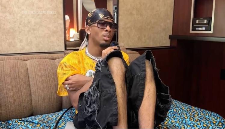 Singer-songwriter David Burke, aka D4vd, sits in the artiste space at the Coachella music festival on April 18, 2025 in Indio, California.