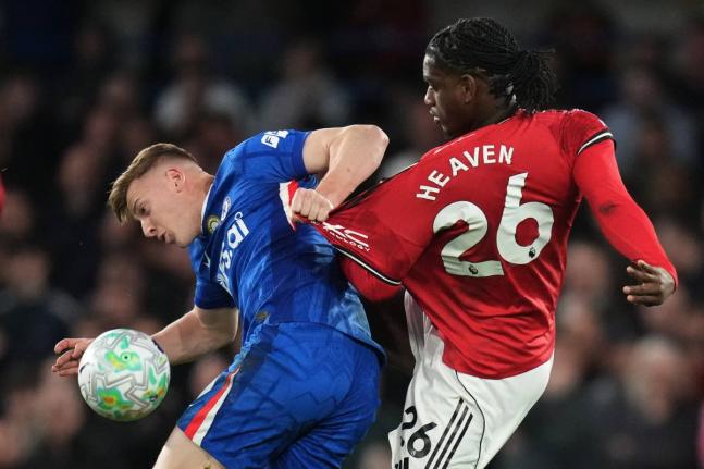 
Chelsea’s Liam Delap (left) and Manchester United’s Ayden Heaven challenge for the ball during their English Premier League football match at Stamford Bridge in London yesterday.