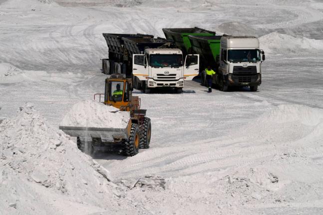 A front-end loader transports phosphogypsum in Phalaborwa, South Africa.