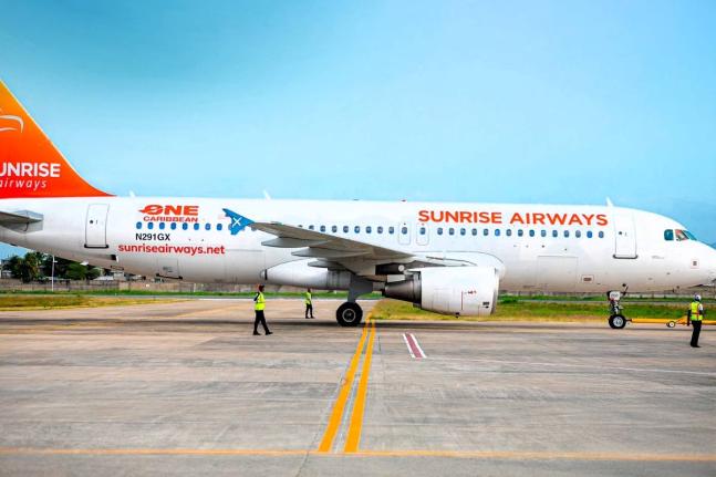 A Sunrise Airways aircraft sits on the tarmac.