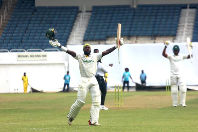 Jamaica Scorpions batsman Kirk McKenzie celebrates scoring a century against the Barbados Pride in thge second-round of the West Indies Championships at Sabina Park yesterday.